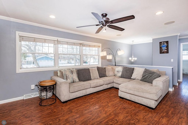 living room featuring crown molding, dark hardwood / wood-style floors, and ceiling fan with notable chandelier