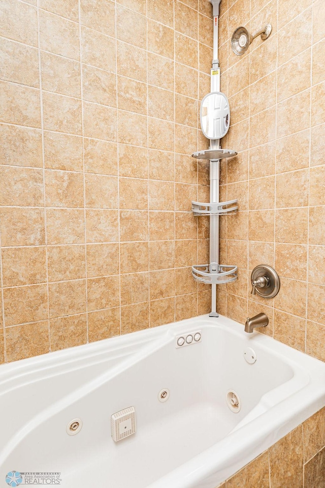 bathroom featuring tiled bath