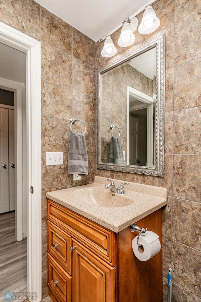 bathroom with vanity and wood-type flooring