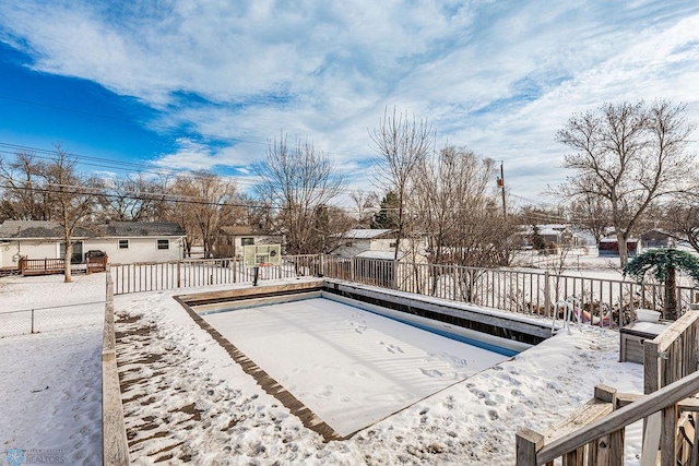 view of snow covered pool