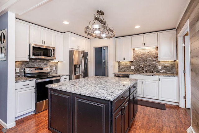 324 Cherry Ct, West Fargo, ND 58078 - kitchen featuring appliances with stainless steel finishes, a sink, white cabinetry, and recessed lighting