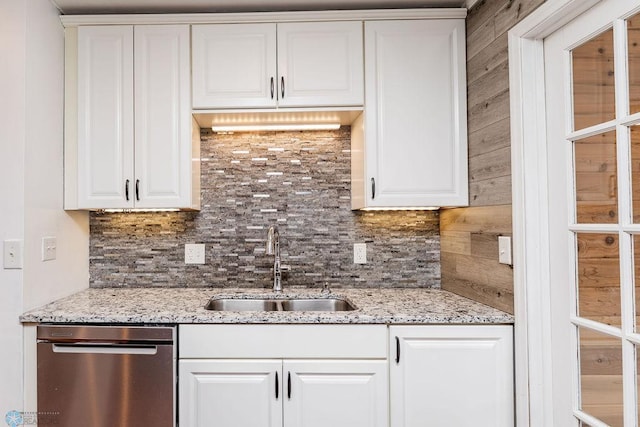 324 Cherry Ct, West Fargo, ND 58078 - kitchen featuring dishwasher, a sink, decorative backsplash, and white cabinetry