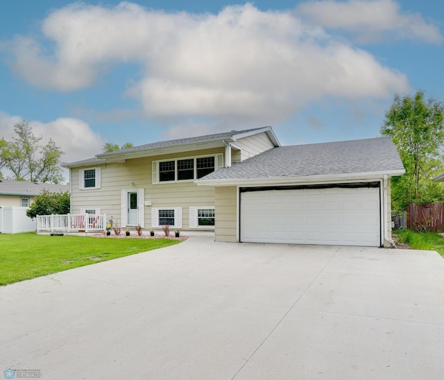 324 Cherry Ct, West Fargo, ND 58078 - split foyer home with a garage and concrete driveway