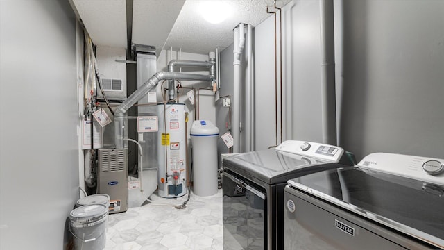 laundry room with separate washer and dryer, a textured ceiling, and gas water heater