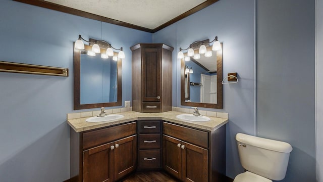 bathroom featuring ornamental molding, hardwood / wood-style floors, vanity, and toilet