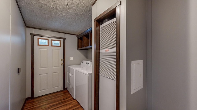 laundry room featuring cabinets, independent washer and dryer, dark hardwood / wood-style floors, and a textured ceiling