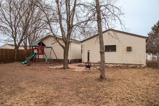 view of side of home with a playground