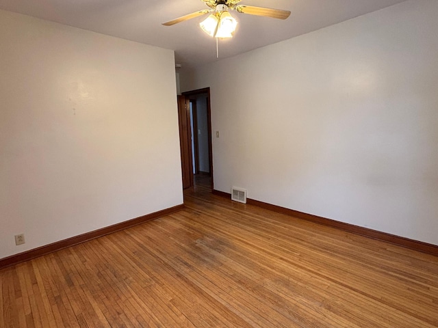 unfurnished room with ceiling fan and light wood-type flooring