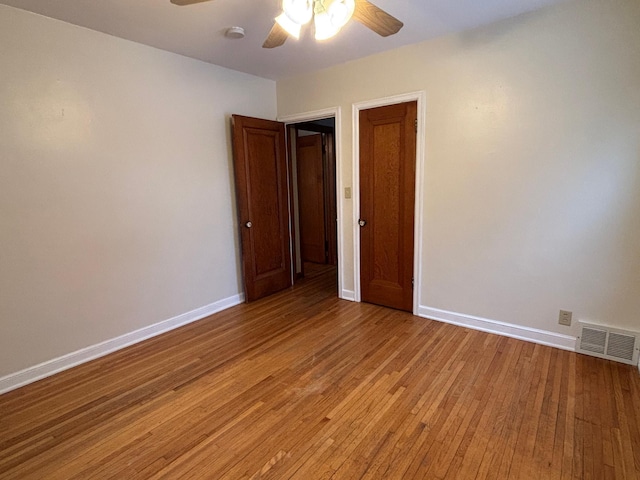 unfurnished room featuring ceiling fan and light hardwood / wood-style flooring