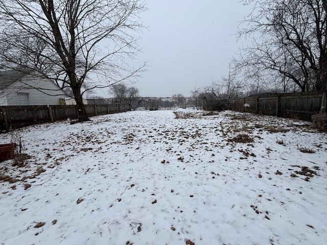 view of yard layered in snow