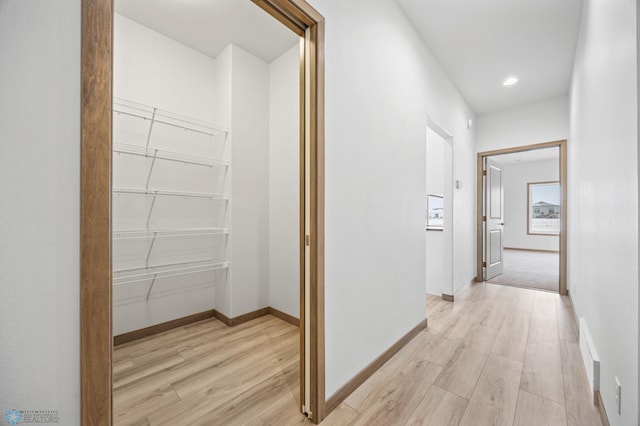 hall featuring light hardwood / wood-style flooring