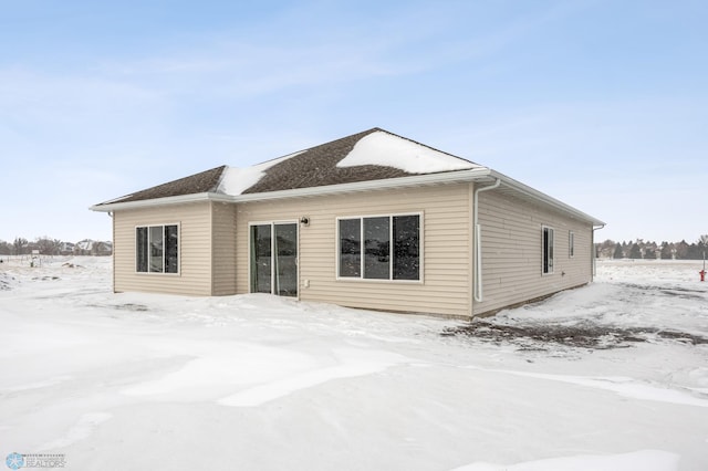 view of snow covered house