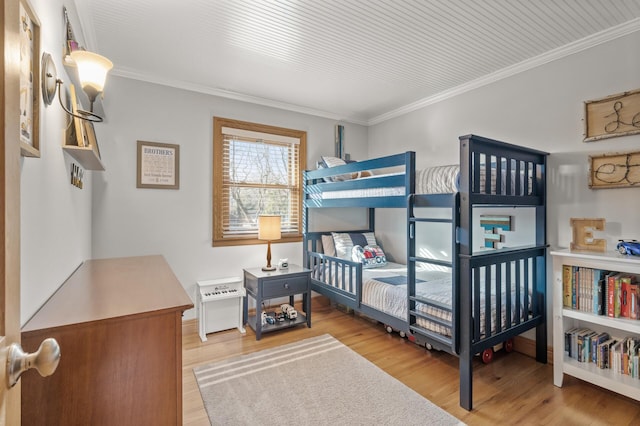 bedroom featuring hardwood / wood-style floors and ornamental molding