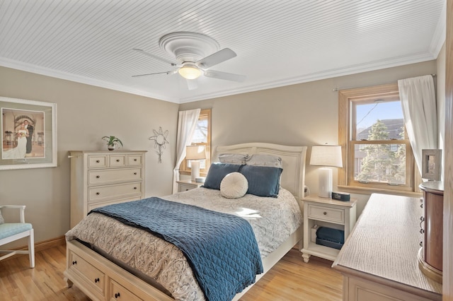 bedroom featuring crown molding, ceiling fan, and light wood-type flooring