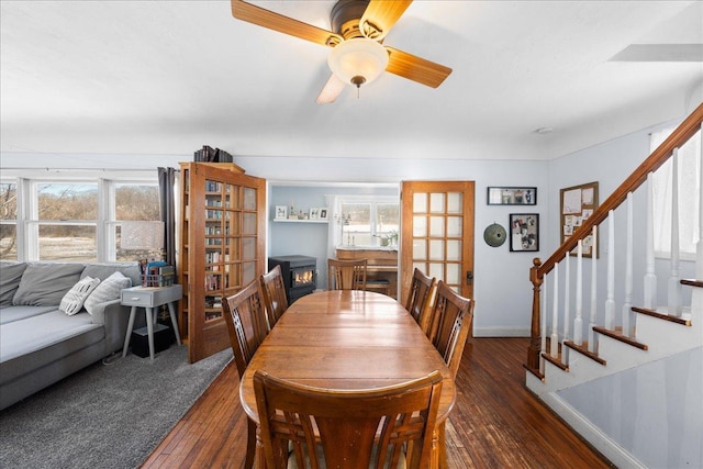 dining room featuring ceiling fan and dark hardwood / wood-style flooring