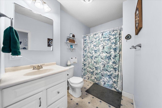 bathroom featuring vanity, a shower with shower curtain, a textured ceiling, and toilet