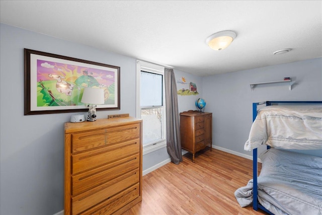 bedroom with light hardwood / wood-style flooring