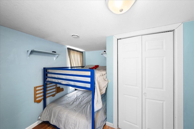 bedroom featuring a closet and a textured ceiling