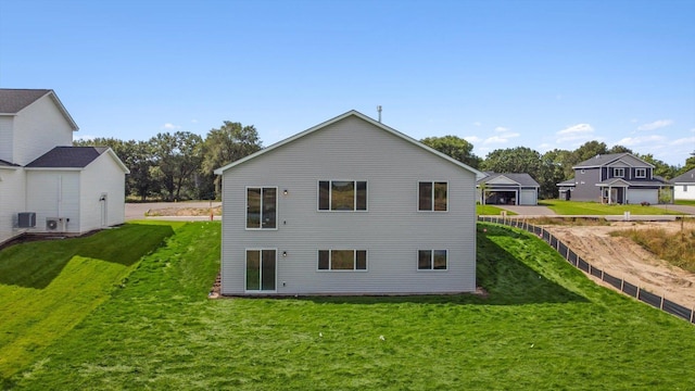 back of property featuring a yard