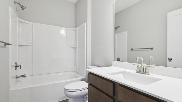 full bathroom with vanity, washtub / shower combination, and toilet