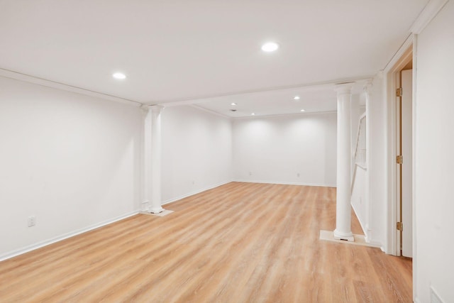 basement with crown molding and light wood-type flooring