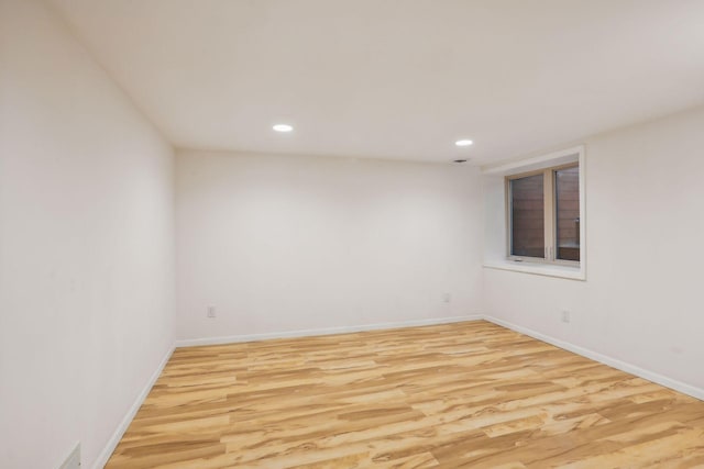 spare room featuring light wood-type flooring