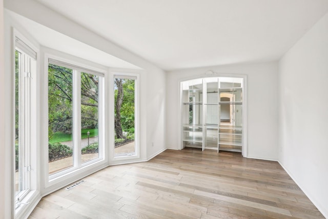 spare room with light hardwood / wood-style floors