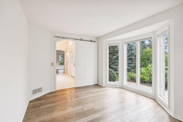 spare room with light wood-type flooring