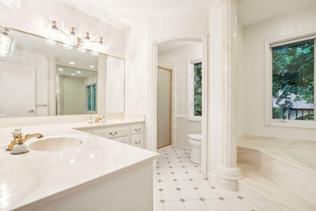 full bathroom featuring vanity, toilet, plus walk in shower, and ornate columns