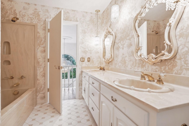 bathroom featuring tile patterned flooring, vanity, and bathtub / shower combination