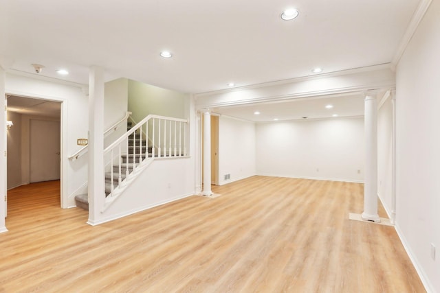 basement with ornamental molding and light wood-type flooring