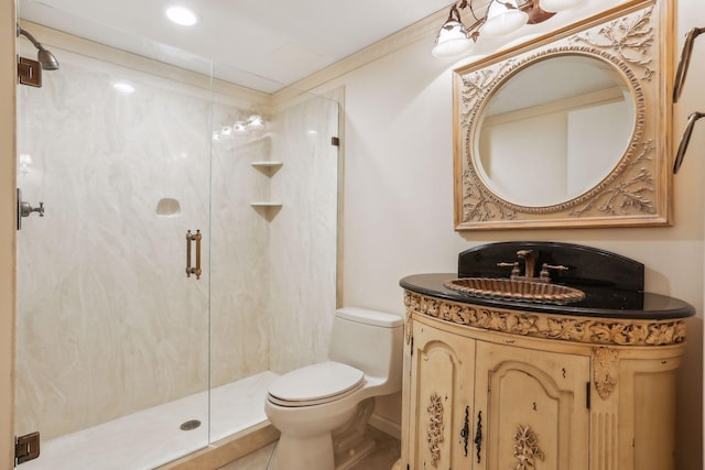 bathroom featuring vanity, an enclosed shower, and toilet