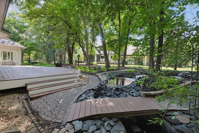 view of community with a wooden deck