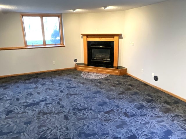 unfurnished living room with carpet