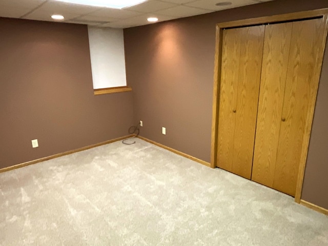 basement with light colored carpet