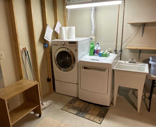 clothes washing area featuring washing machine and dryer