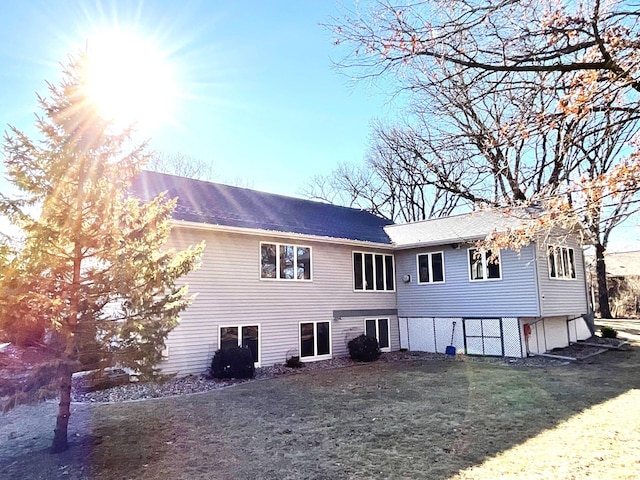 rear view of house with a lawn