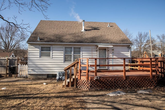 rear view of house with a wooden deck