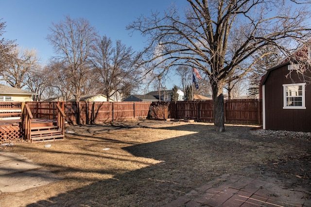 view of yard featuring a wooden deck