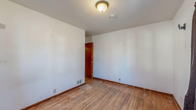 unfurnished room featuring light wood-type flooring