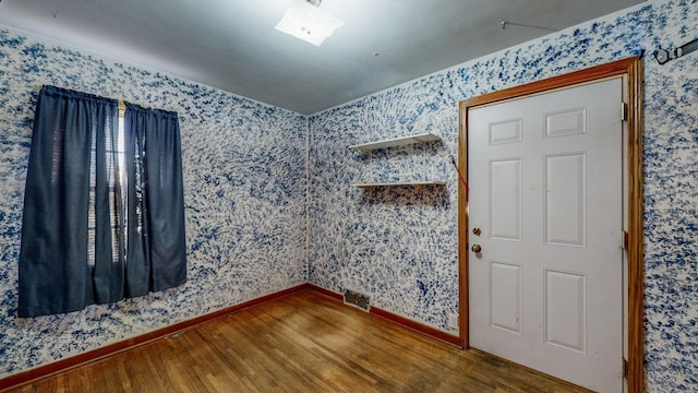 unfurnished room featuring hardwood / wood-style flooring