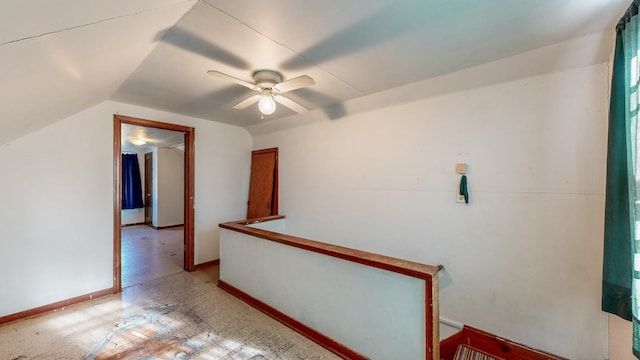 hall featuring lofted ceiling