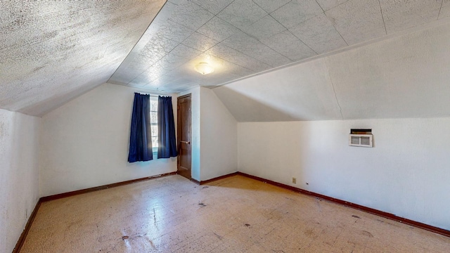 additional living space with vaulted ceiling