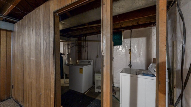 basement featuring wooden walls