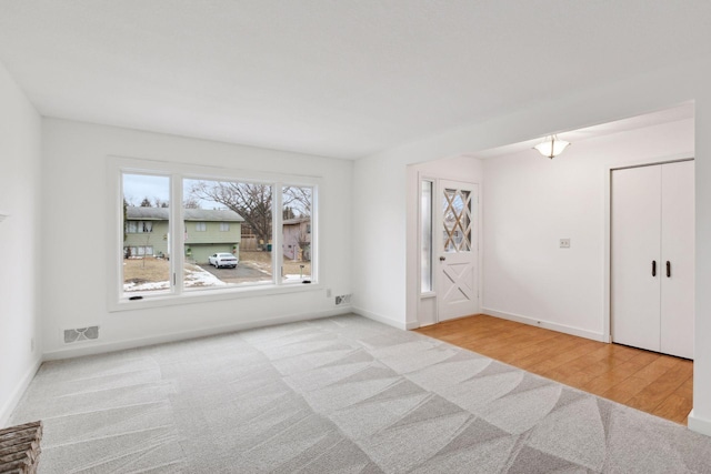 spare room featuring light hardwood / wood-style flooring