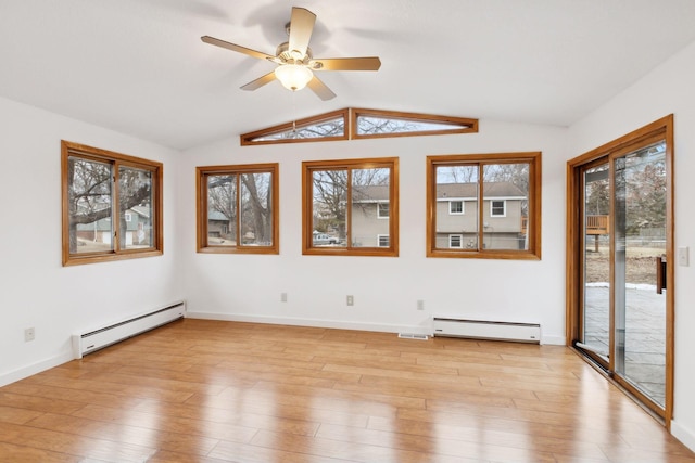 empty room featuring ceiling fan, a baseboard radiator, vaulted ceiling, and light wood-type flooring