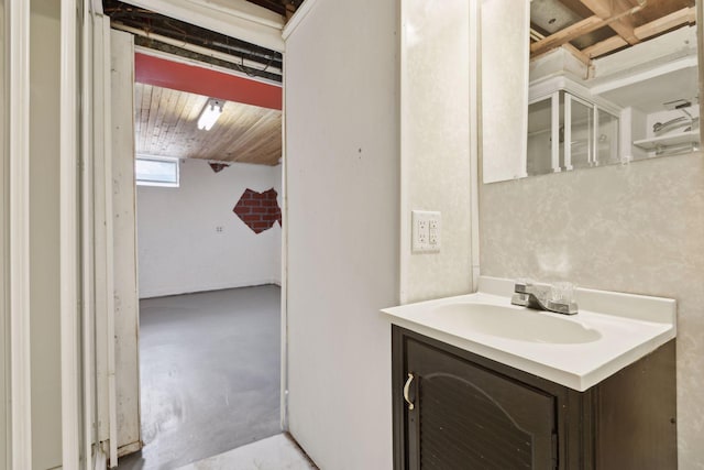 bathroom with concrete flooring and vanity