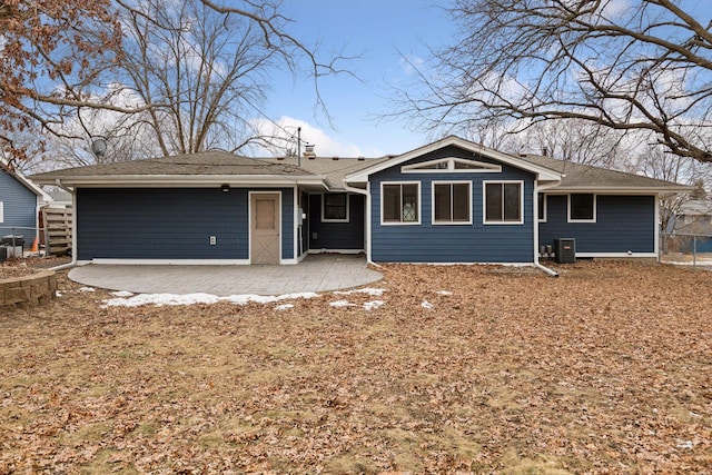 ranch-style home featuring cooling unit and a patio