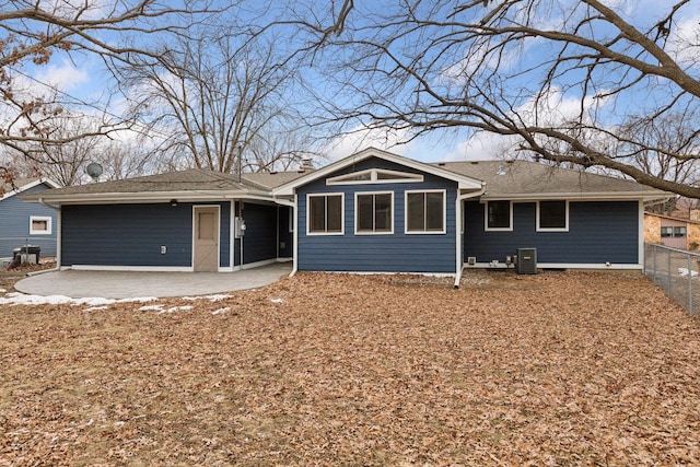 single story home featuring cooling unit and a patio area