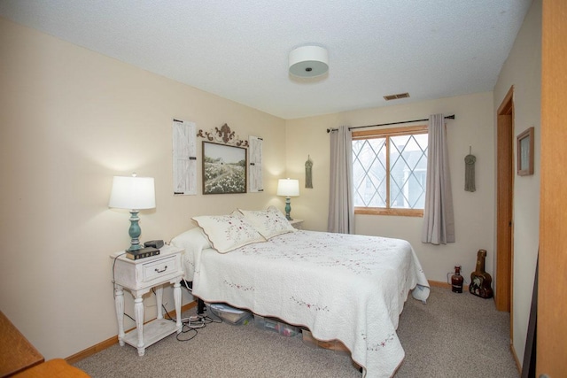 carpeted bedroom with a textured ceiling